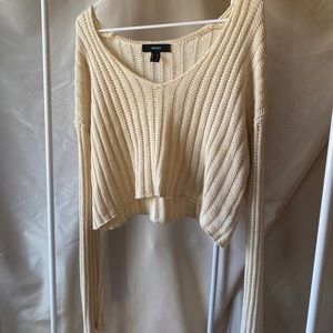 Cream knitted sweater.